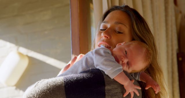 Mother Embracing Her Newborn Baby in Cozy Home Environment - Download Free Stock Images Pikwizard.com