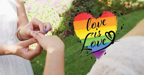 Diverse Female Couple Proposing with Rainbow Heart Theme