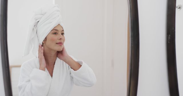 Woman in Bathroom with Towel on Head Admiring Reflection - Download Free Stock Images Pikwizard.com