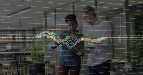 Team Analyzing Data with Tablet in Modern Office Environment