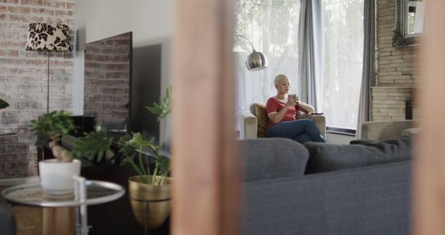 Woman Relaxing at Home with Coffee in Modern Living Room - Download Free Stock Images Pikwizard.com