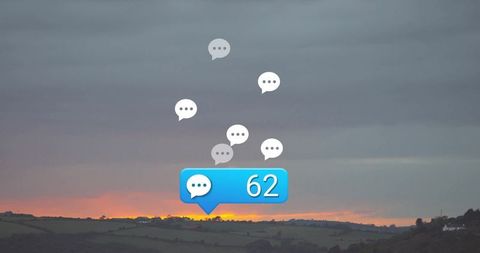 Floating Chat Bubbles Against Serene Sunset Over Fields