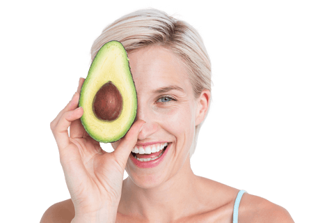 Smiling woman holding half avocado, transparent background