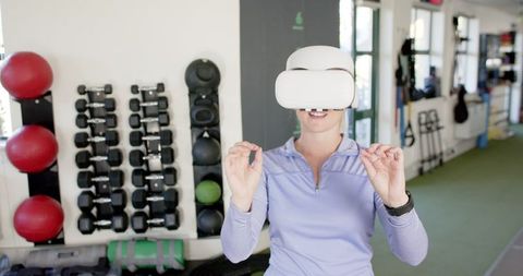Woman Using VR Headset in Rehabilitation Center for Therapy