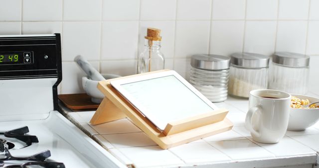 Reading Tablet Propped on Stand in Kitchen - Download Free Stock Images Pikwizard.com