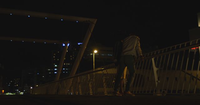 Couple Walking on Urban Bridge at Night - Download Free Stock Images Pikwizard.com