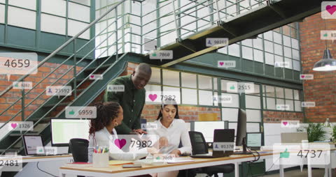 Diverse Team Collaborating in Modern Office with Social Media Icons
