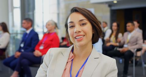 Confident Asian Businesswoman at Professional Seminar