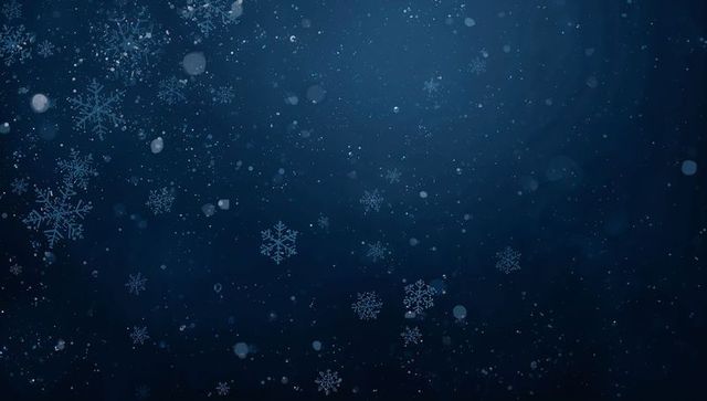 Shimmering blue snowflakes drifting over deep navy gradient background for winter designs