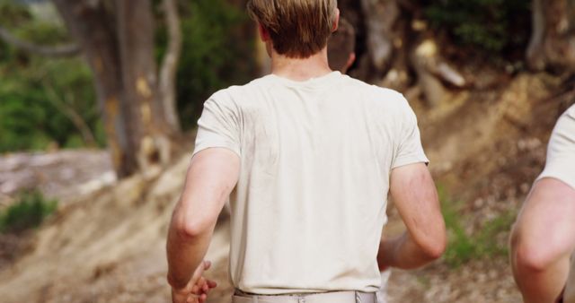 Rear View of Men Running Outdoors in Casual Clothes - Download Free Stock Images Pikwizard.com