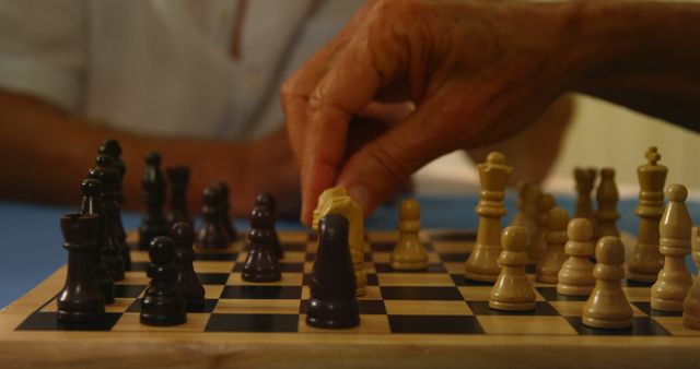 Close-up of hands playing chess at home 4K