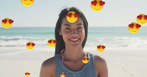 Smiling Woman on Beach with Heart Emojis