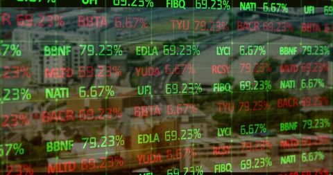 Digital stock market ticker overlaying urban aerial view showing real-time trading activity