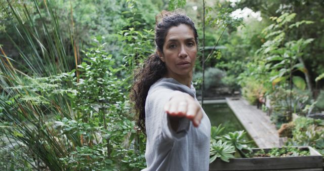 Woman Practicing Yoga in Lush Garden for Wellbeing - Download Free Stock Images Pikwizard.com