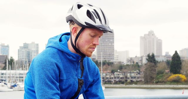 Young Man in Blue Jacket Resting After Cycling in Urban Park - Download Free Stock Images Pikwizard.com