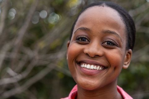 Smiling african american woman outdoors close-up portrait expressing joy and confidence