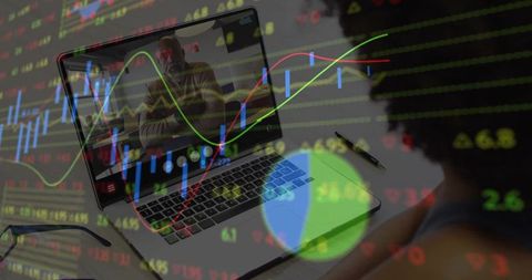 Professional executing data analysis with trend graphs on laptop