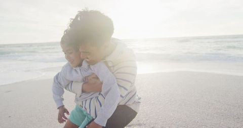 Father Embracing Daughter on Sunny Beach - Download Free Stock Images Pikwizard.com