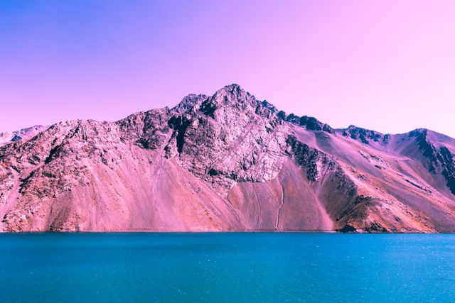 Vibrant Mountain Range with Pink Sky Over Cerulean Lake - Download Free Stock Photos Pikwizard.com