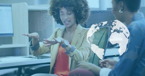 Businesswoman gesturing in workspace during global collaboration meeting with digital world map over
