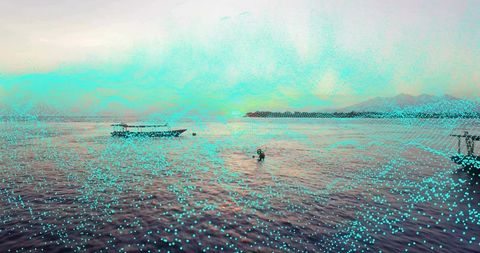 Tranquil coastal landscape with swimmer and boats