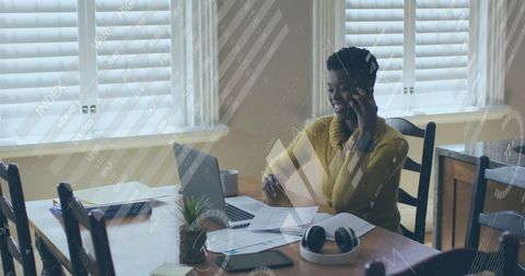 Smiling African American Woman Managing Finance Data from Home