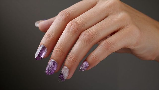 Female Hand Displaying Purple Crystal Mosaic Nail Art Glossy Almond-Shaped Manicure