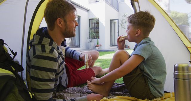 Father and Son Enjoying Sandwiches Inside Backyard Tent - Download Free Stock Images Pikwizard.com