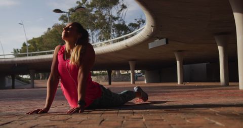 Athletic Woman Stretching Outdoors under Urban Bridge - Download Free Stock Images Pikwizard.com