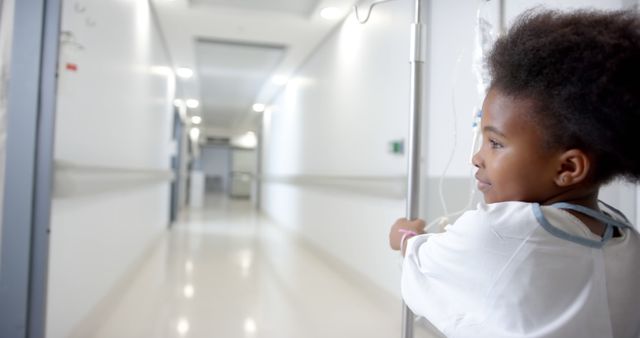 Little Girl in Hospital Gown Walking Down Hospital Hallway - Download Free Stock Images Pikwizard.com