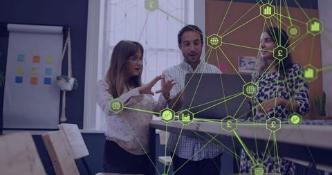 Colleagues collaborating over laptop featuring neon green network overlay visualizing data flow