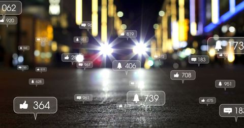 Social Media Engagement Icons Over Blurred City Night Scene