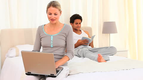 Comfortable Home Routine with Laptop and Book