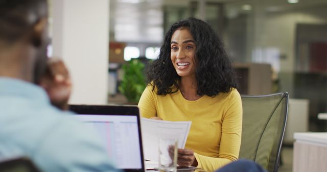 Smiling Businesswoman Discussing Document in Office Meeting - Download Free Stock Images Pikwizard.com