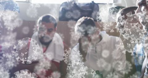 Football Players in Locker Room with Digitally Imposed Virus Cells