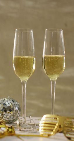 Two Champagne Glasses with Festive Disco Ball and Party Accessories - Download Free Stock Images Pikwizard.com