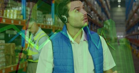 Inspecting warehouse inventory with headset and scanner, logistics analytics overlay