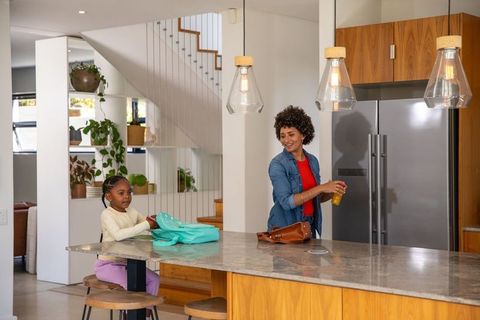 Mother and Daughter Bonding in Contemporary Home Kitchen