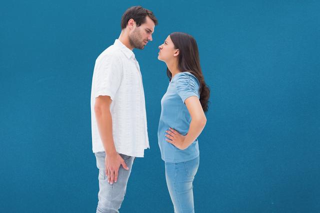 Digital composite of Side view of displeased couple against blue background