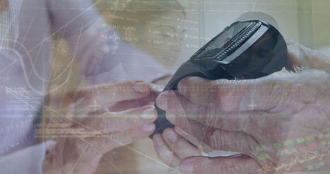 Caregiver assisting elderly with blood glucose monitoring device