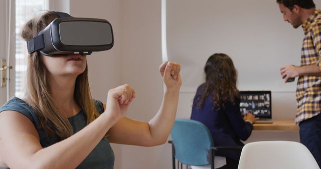 Young Woman Using VR Headset in Modern Office Space - Download Free Stock Images Pikwizard.com