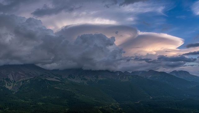 Majestic Lenticular Cloud Over Dramatic Mountain Valley