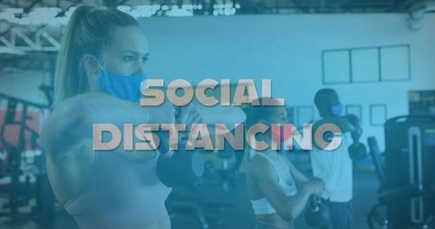Diverse People Exercising with Masks in Gym Showing Social Distancing