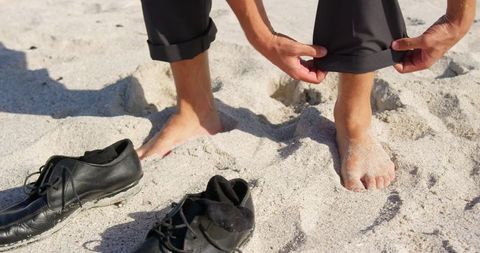 Businessman Enjoying Leisure on Sandy Beach