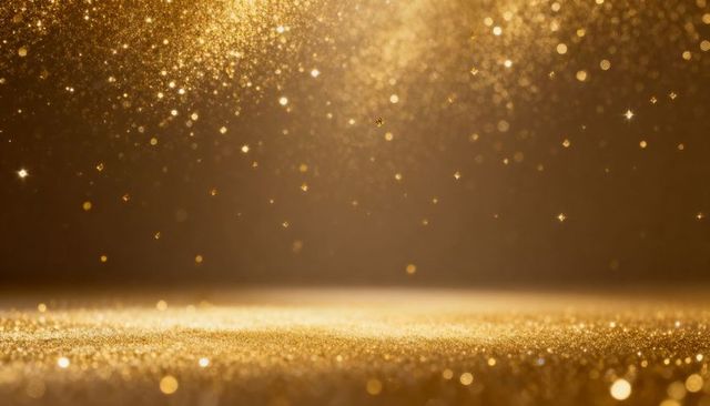 Glittering gold bokeh background creating warm sparkle, shimmer and luxury glow