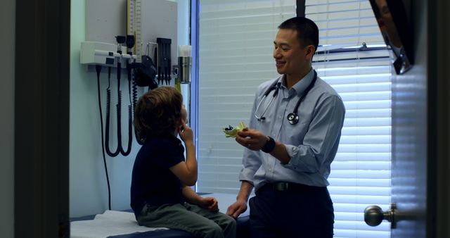 Pediatric Doctor Interacting with Young Patient in Examination Room - Download Free Stock Images Pikwizard.com