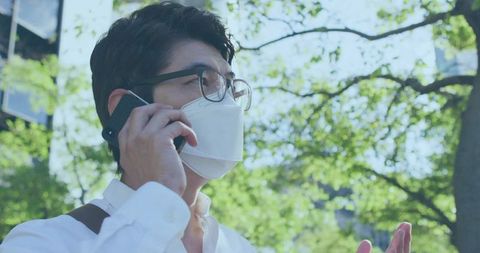 Business Professional Talking on Phone Outdoors with Face Mask