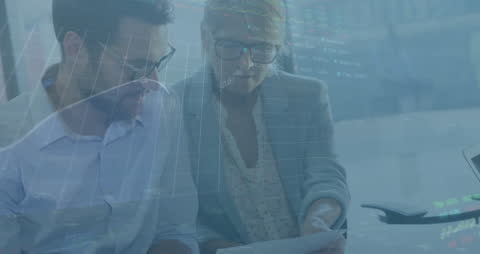 Business Professionals Analyzing Data with Trading Graph Overlay