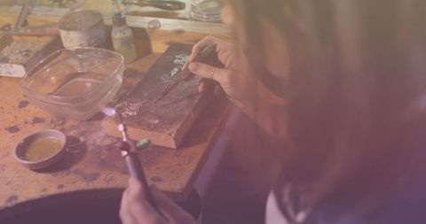Blurry Female Craftsperson Repairing Jewelry in Workshop - Download Free Stock Images Pikwizard.com