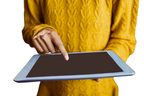 Transparent screen tablet used by person in cozy yellow sweater
